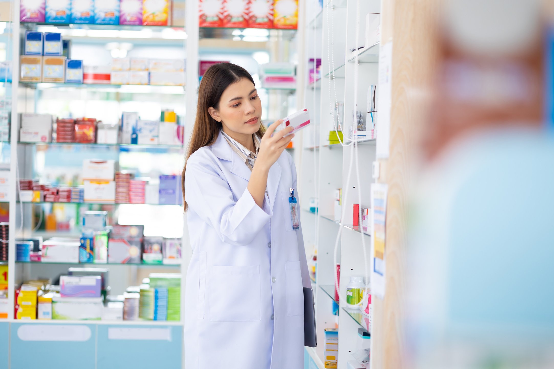 Pharmacy Drugstore. Portrait Professional Pharmacist caucasian women working at pharma store. Health and wellness center